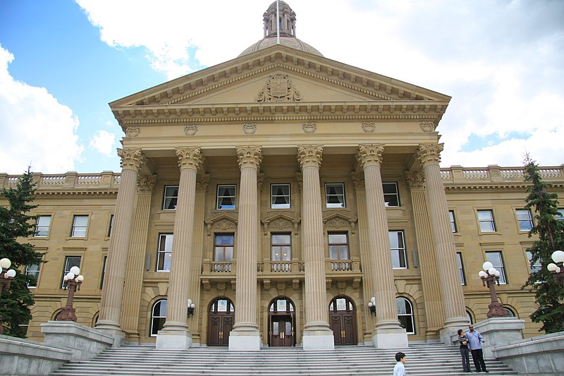 What benefits or financial assistance can a low-income earner receive in Edmonton, Alberta